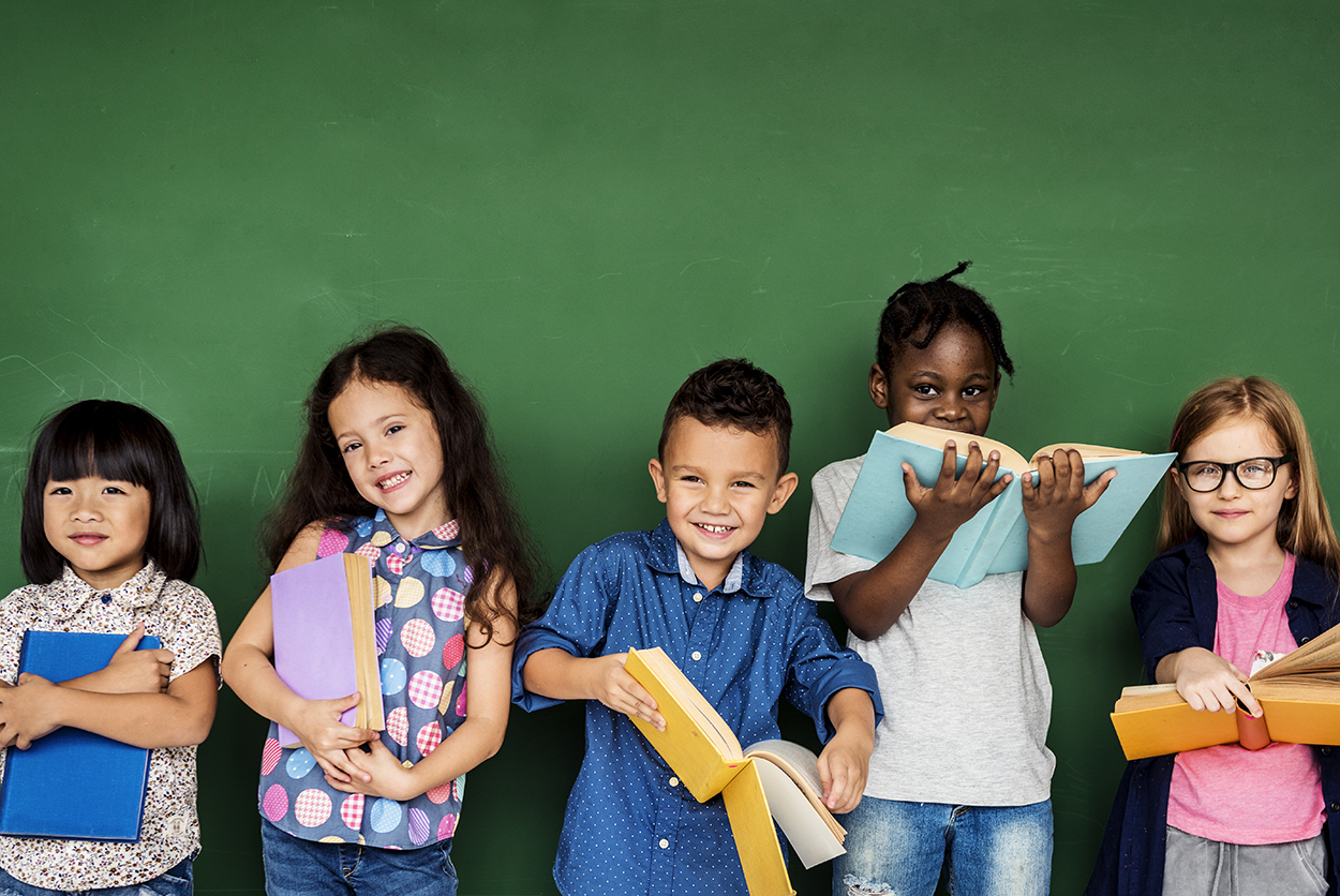 Group of school kids reading for education